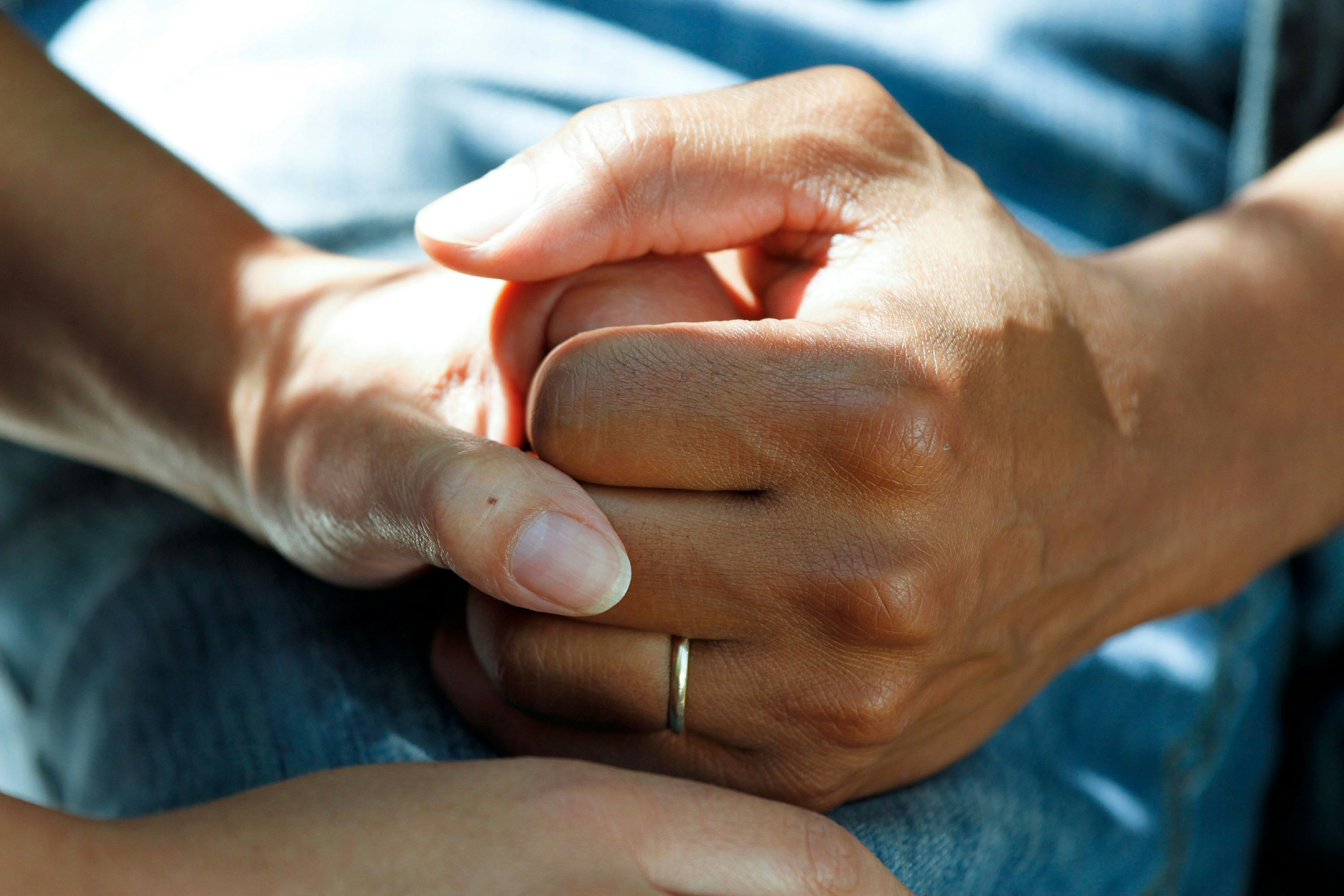 Hand-holding, credit: National Cancer Institute on Unsplash